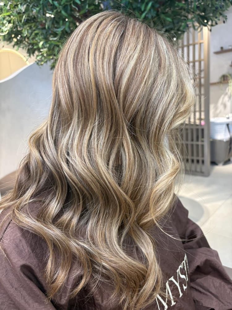 Sleek hair styling result at MYSTT
